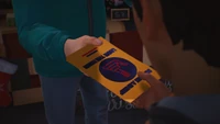 Nick handing Sean a political leaflet (determinant).