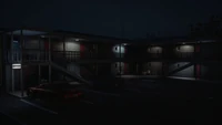 The motel's parking lot.