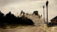 The half of the building collapses.