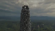 The Petronas Towers begins to collapse.