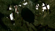 The hollow, corroded interior of the donut with water inside.