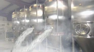 The fermentation tanks emptying its content.