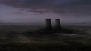 The cooling towers stand intact amidst a dead zone after the power plant's reactor melted down.