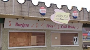 A boarded up building.