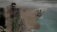 The blue tower falls onto the green tower.