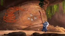 Bunga uses Rafiki's staff to make cave paintings move.