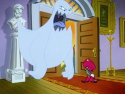 The mansion owner reveals himself to be the ghost.