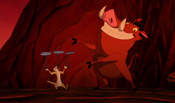 Timon and Pumbaa stall the hyenas while Ma and Max dig a trap tunnel.