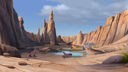 Jasiri's clan returns to their watering hole.