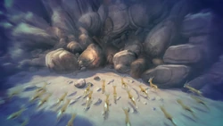 Swala's herd stands beneath an unstable rock pile.