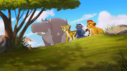 The Lion Guard overlooks the hyenas chasing the zebras
