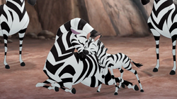 Muhimu nuzzles her newborn son.