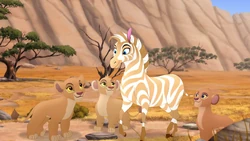 Kiara, Tiifu, and Zuri give Dhahabu a tour of the Pride Lands.