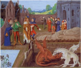 The boy Merlin shows King Vortigern that his castle is collapsing because a red and a white dragon are fighting underneath it. Illustration from a 15th-century manuscript of History of the Kings of Britain in Lambeth Palace, London.