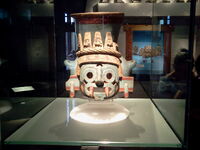 This vase represents Tlaloc (Classical Nahuatl: Tlāloc [ˈtɬaːlok]). He was a member of the pantheon of gods in Aztec religion. As supreme god of the rain, Tlaloc was also a god of earthly fertility and of water