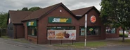 The building as a Burger King and Subway