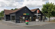 The building as a Burger King and Subway