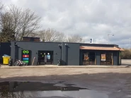The building as Burger King, Greggs and Subway