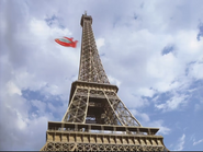 Rocket flying around the Eiffel Tower. Notice how he uses his design from the second trailer.