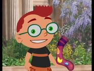 Leo holding silly sock at the art museum