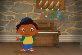 Quincy with the Piano and 4 Colored Keys