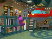 Rocket dusting his books.jpeg (76 KB)