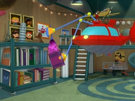 Rocket dusting his books