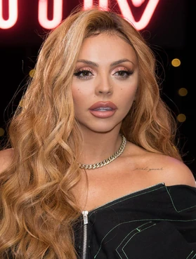 Jesy has "girl power" tattooed on her left shoulder