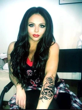 Jesy has a skull and rose tattoo on her lower left arm