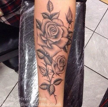 A giant rose tattoo from her wrist to her elbow.