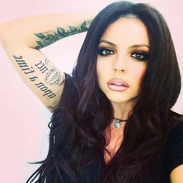 Jesy's feather and eye tattoo on her left forearm