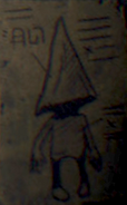 A box label featuring a Nome that appears on many different packages in Little Nightmares II.