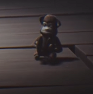 Toy monkey with cymbals from Little Nightmares