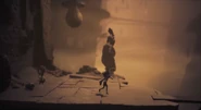 A crow standing on top of a Dweller's head.