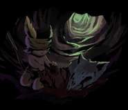 Малыш собирает из трупа волка внутренности в свой мешочек.