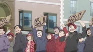 Angry mob continue marching past Akko and Andrew LWA 22.jpg (703 KB)