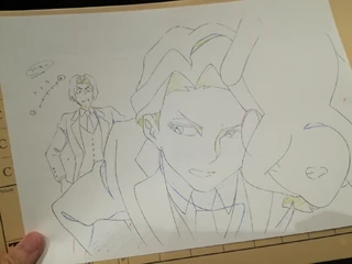 Cel-shade shot of Andrew examining MouseAkko against Louis' protests