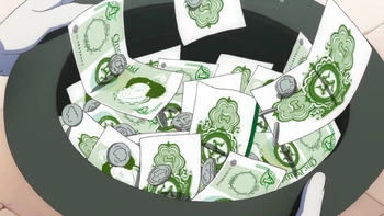 Gathered paper money with distinct triskelion symbol of Flag of Isles of Man.
