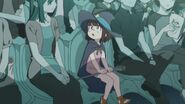 Young Akko with her (implied) parents in the first film