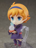 Lotte without glasses looks at her crystal ball.