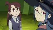 Akko and Ursula glances at the painting of artistic rendition of the seal of Grand Triskellion LWA 15