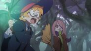Lotte warns Akko about the ominous plant in front of her while Sucy giggles LWA 01