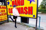 LIZ in front of a car wash sign