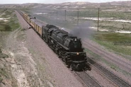 Union Pacific 3985 pulls a small train in 1982.