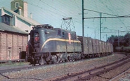 A GG1 is hauling a Freight Train.