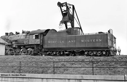 N&W No. 1119 is taking on coal at Waynesboro, VA in 1956.