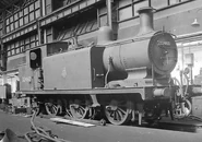 Mm 32460.jpg (147 KB) Now Nº32460, and wearing the early British Railways crest, a rodless Nº2460 is seen here undergoing some attention in the works!