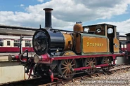 Stepney sits at a station.
