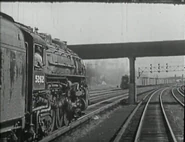 Hudson5262.png (1.55 MB) NYC Hudson No. 5262 a J-1c is passing an oncoming freight train.