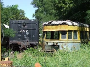587's Tender is in storage next to a Streetcar.